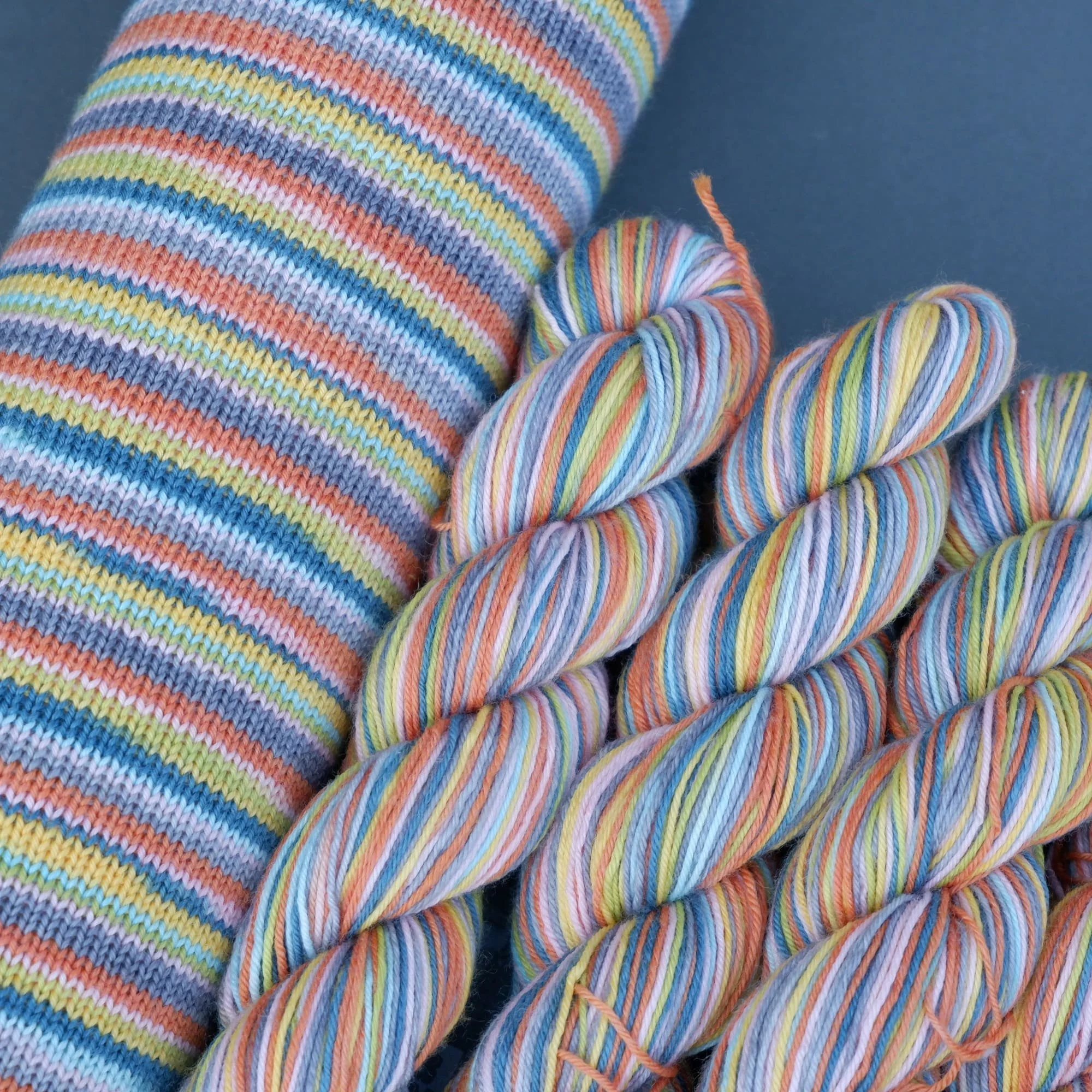 Self-striping sock yarn Hand-dyed in fine micro-stripes creates a chaotic colour way