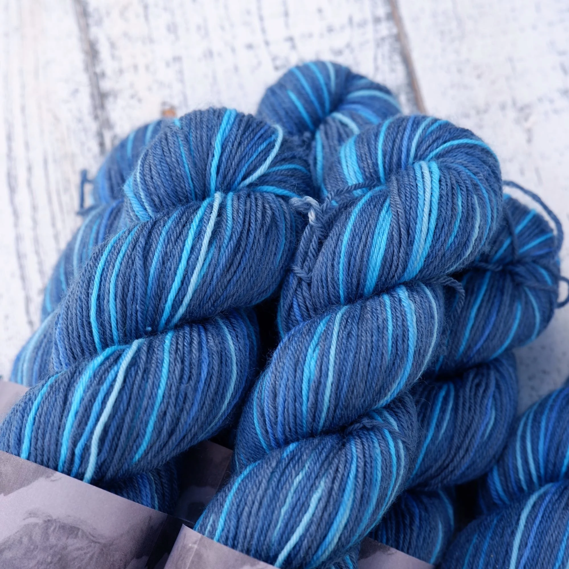 10 stripe hand dyed self-striping yarnFab Funky Fibres. Petite stripes of cool blues separated by a wide navy stripe