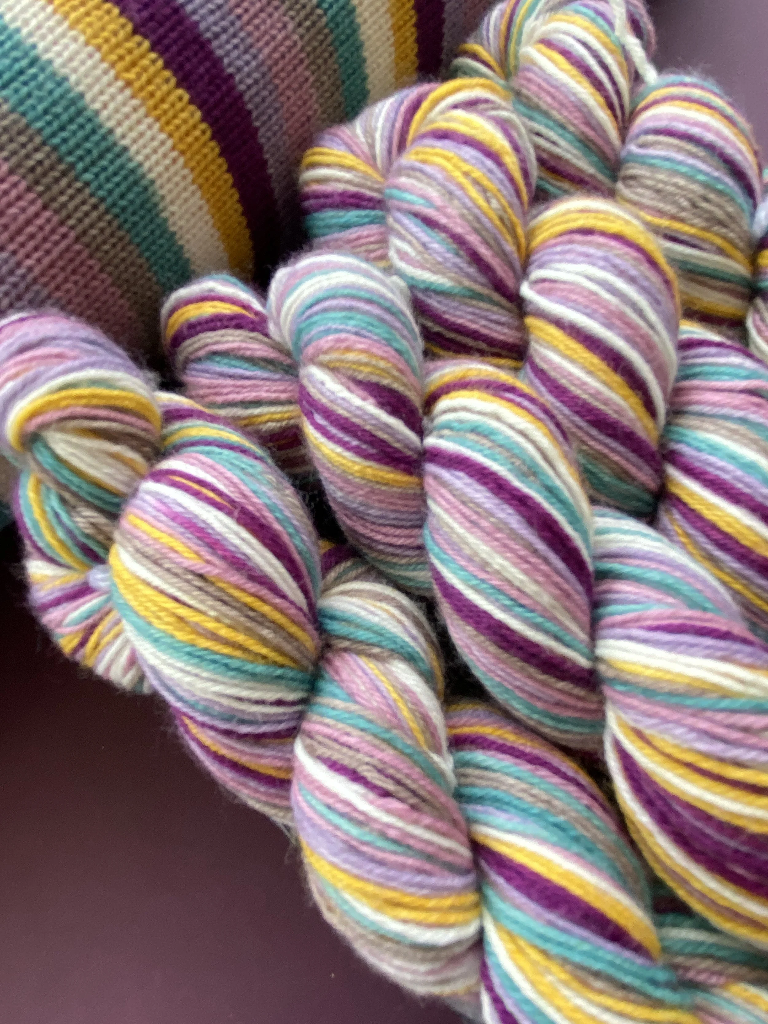 Discover our unique collection of hand dyed self-striping yarn. Perfect for knitting and crocheting, our unique colorways will elevate your projects. Shop now!