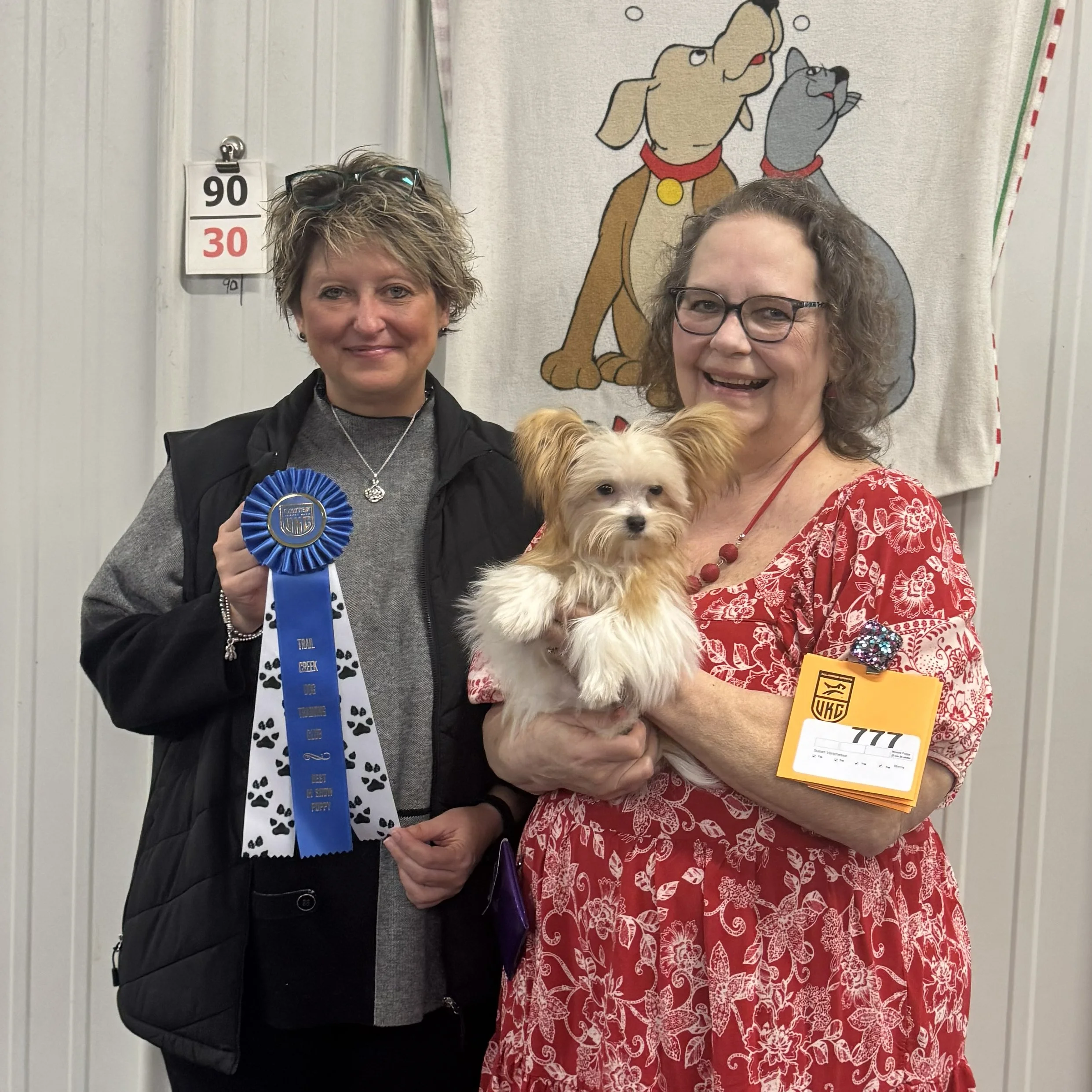 Susan Versmesse of Li'l Angels Mi-Kis (Indiana) with her Best in Show Novice Puppy