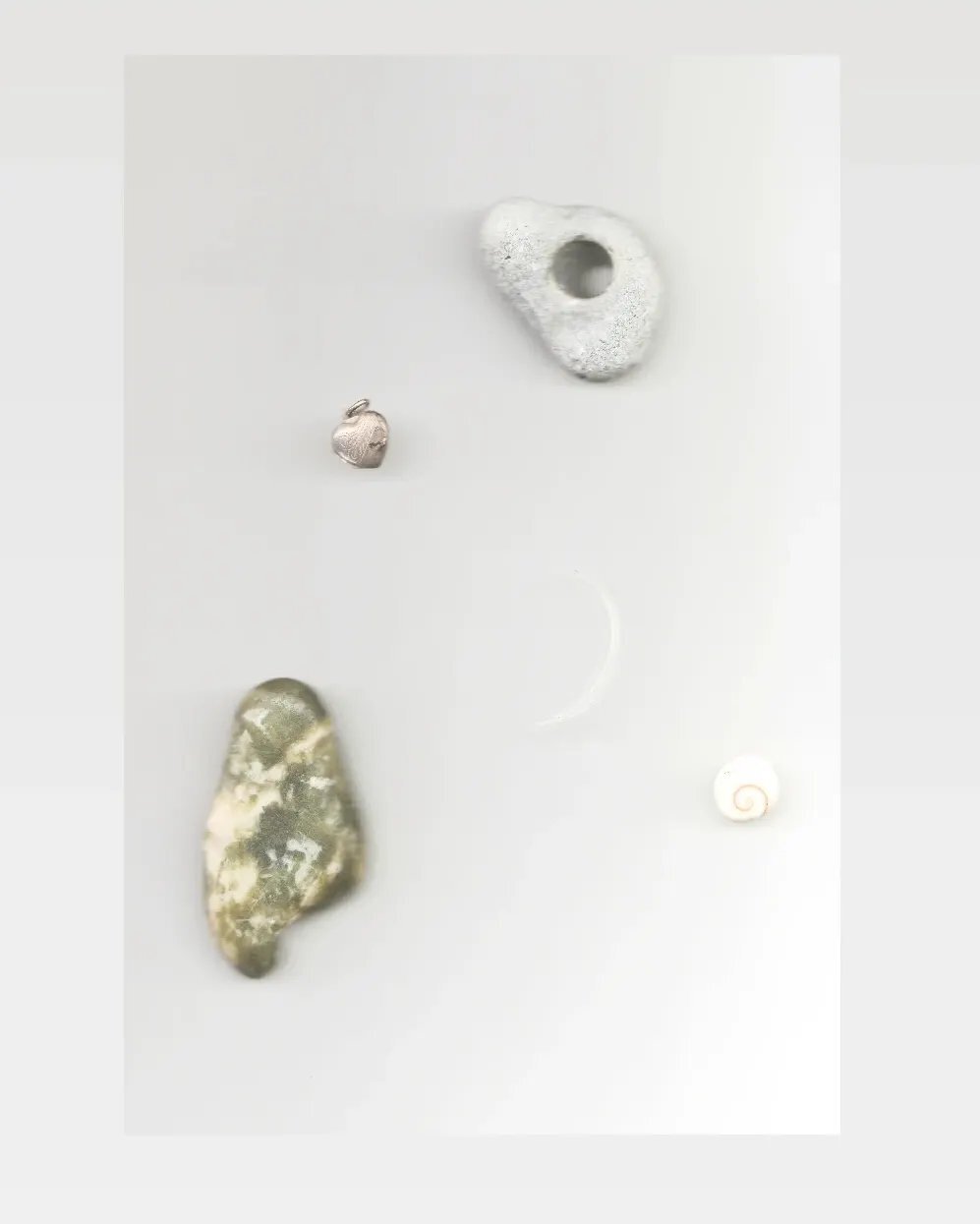 1. Things found in and from Scotland: hag stone found on a beach on the Isle of Iona in the last few days we were there, a wee spiral seashell, a lock of my grandmother's hair shaped liked a crescent moon, a small heart shaped locket, Iona marble gif