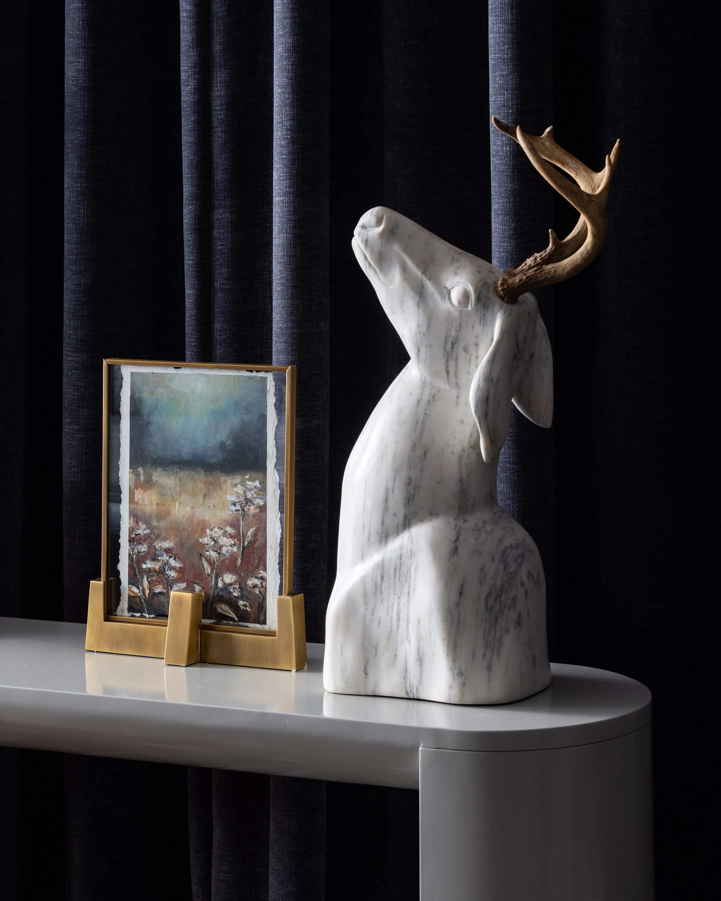 Detail of small painting and deer head