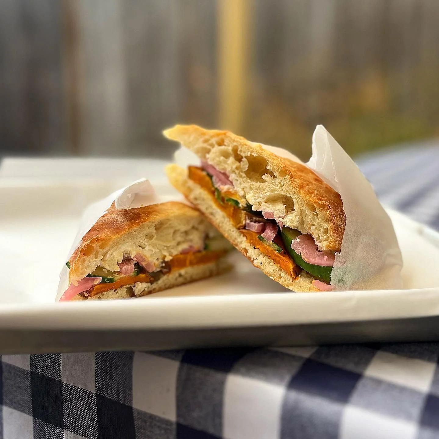 Say to hello to our *new* veggie sandwhich for the fall &amp; winter season! 

Slow roasted slices of sweet potato, crunchy cucumbers, house made pickled red onions, and whipped feta on top of handmade stecca bread! The perfect combo of sweet, crisp 