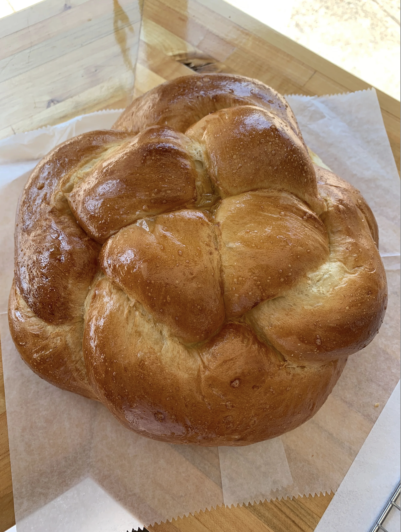 a picture of a round braided challah