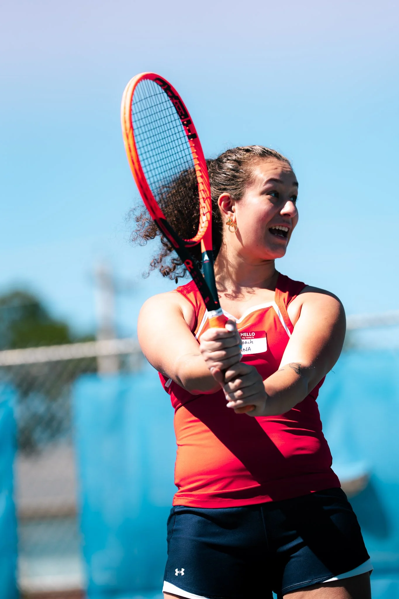 coach showing how to hold a tennis racket