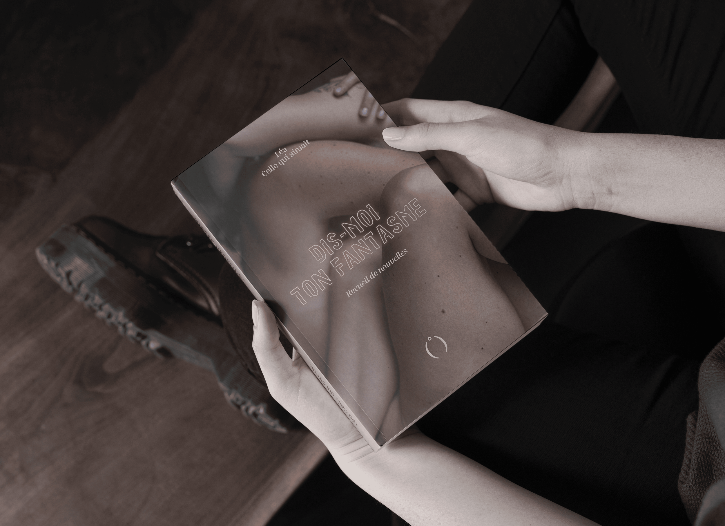Book In Hand Mockup.png