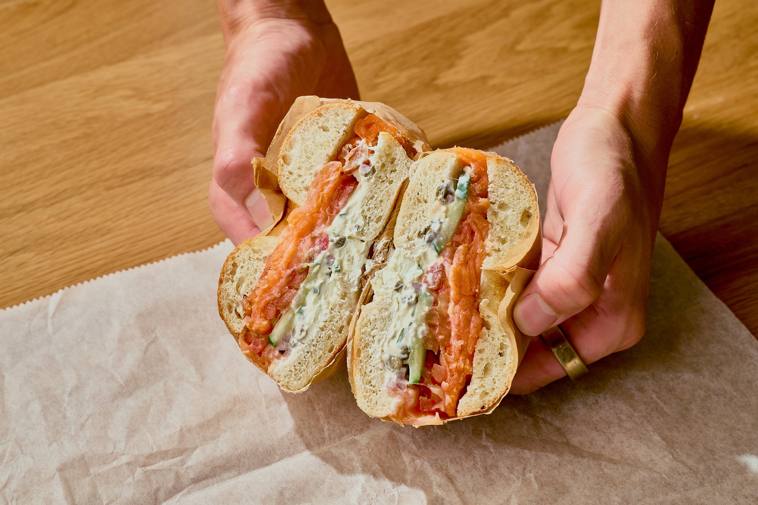 Lox and veggies on a sourdough bagel