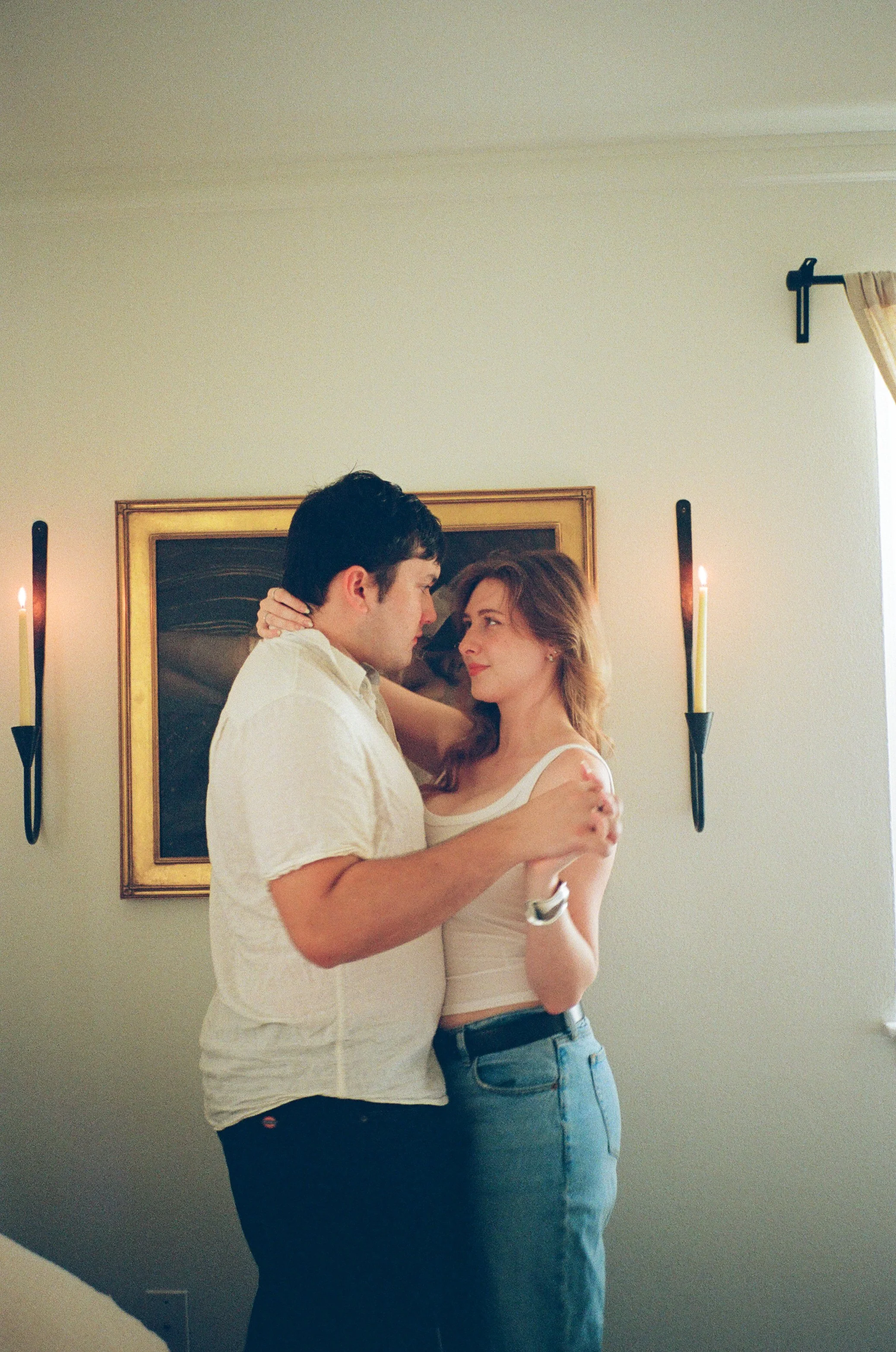 Candid couple cuddling at home during film anniversary shoot.jpg