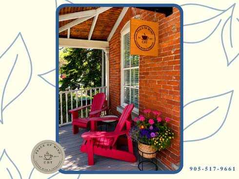 Welcoming front porch entrance of Peace of Mind CBT in Burlington, Ontario, with seating, flowers and clinic signage.