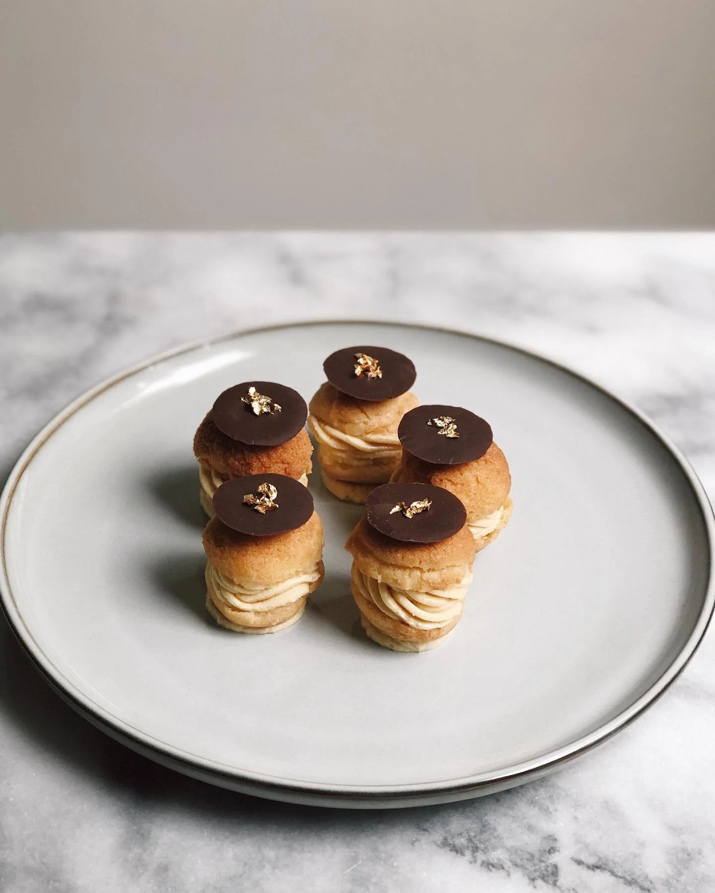 Recreated @masterchefau 2020 winner @emelia_jackson &lsquo;s Paris-Brest Petit Fours and I&rsquo;m obsessed with this fererro roceher-like flavour!! The choux pastry and hazelnut mousseline is French pastry perfection and topped off with tempered cho