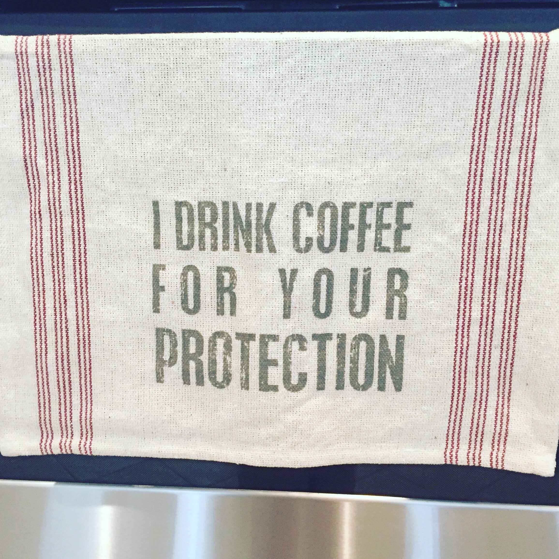 'I Drink Coffee For Your Protection' Kitchen Towel