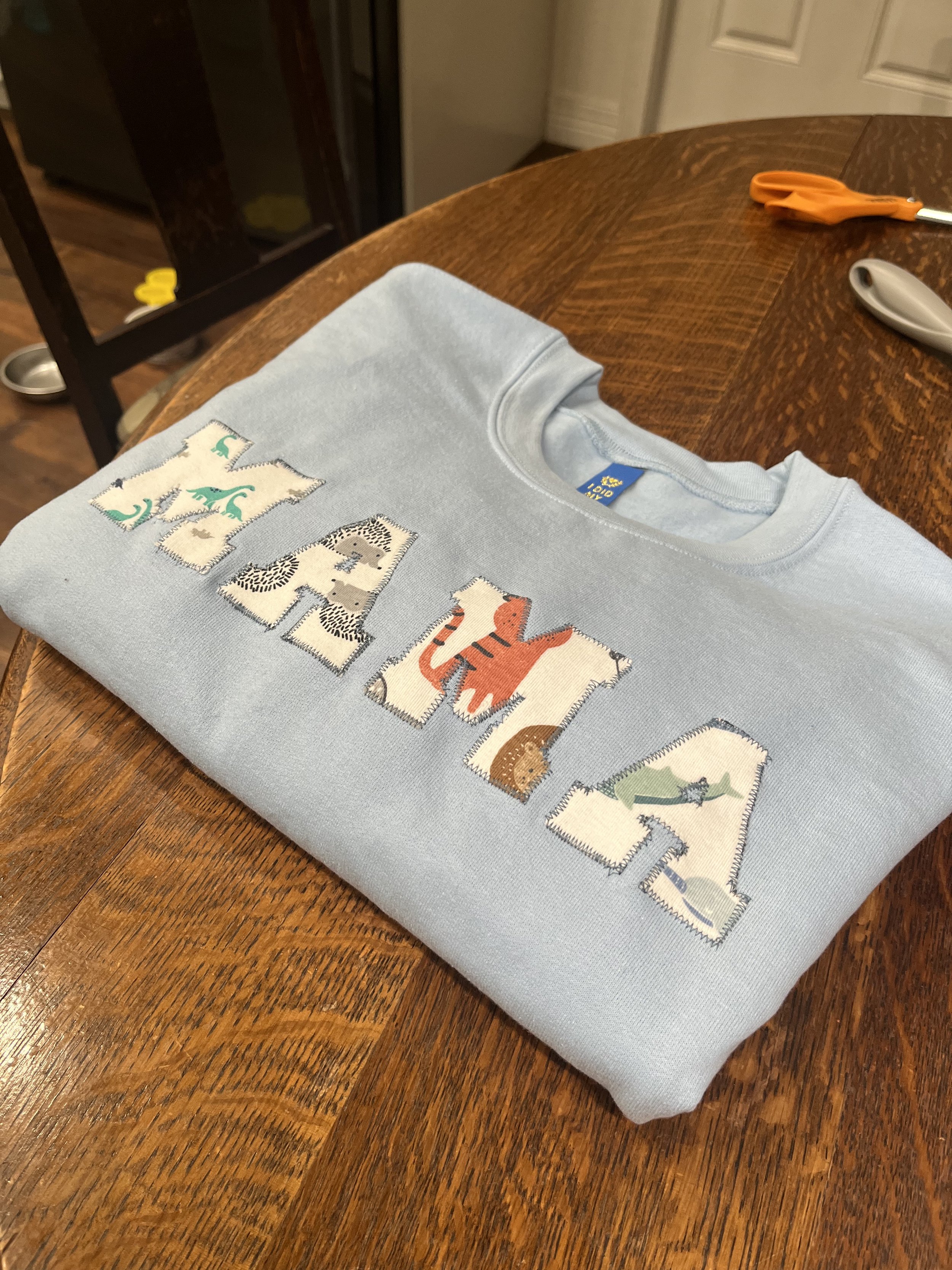 Mama Sweatshirt with Brett's Baby Clothes