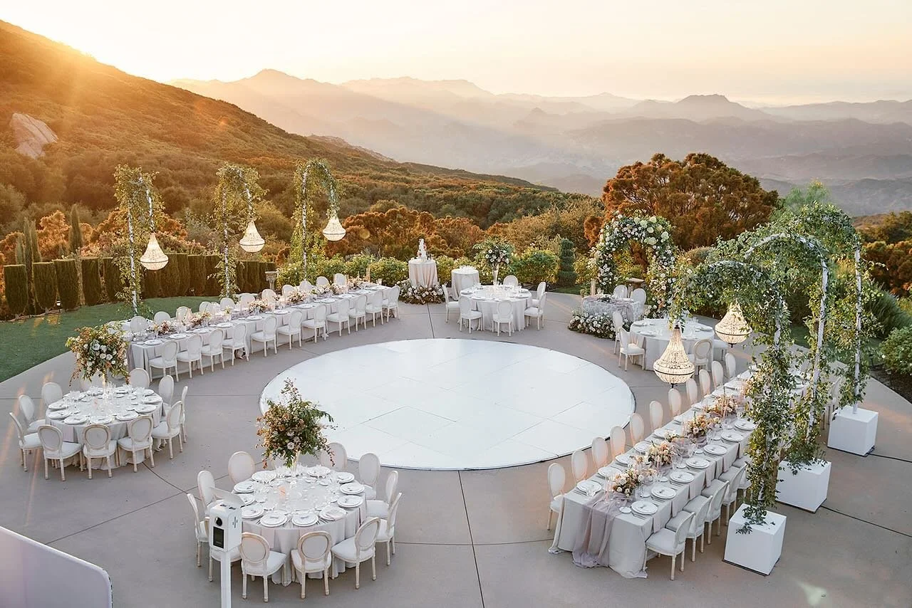 As the sun dipped below the horizon, the sky transformed into a breathtaking palette of colors, each hue blending seamlessly into the next. This wasn’t just any evening; it was the backdrop for a wedding celebration that promised to be as vibra