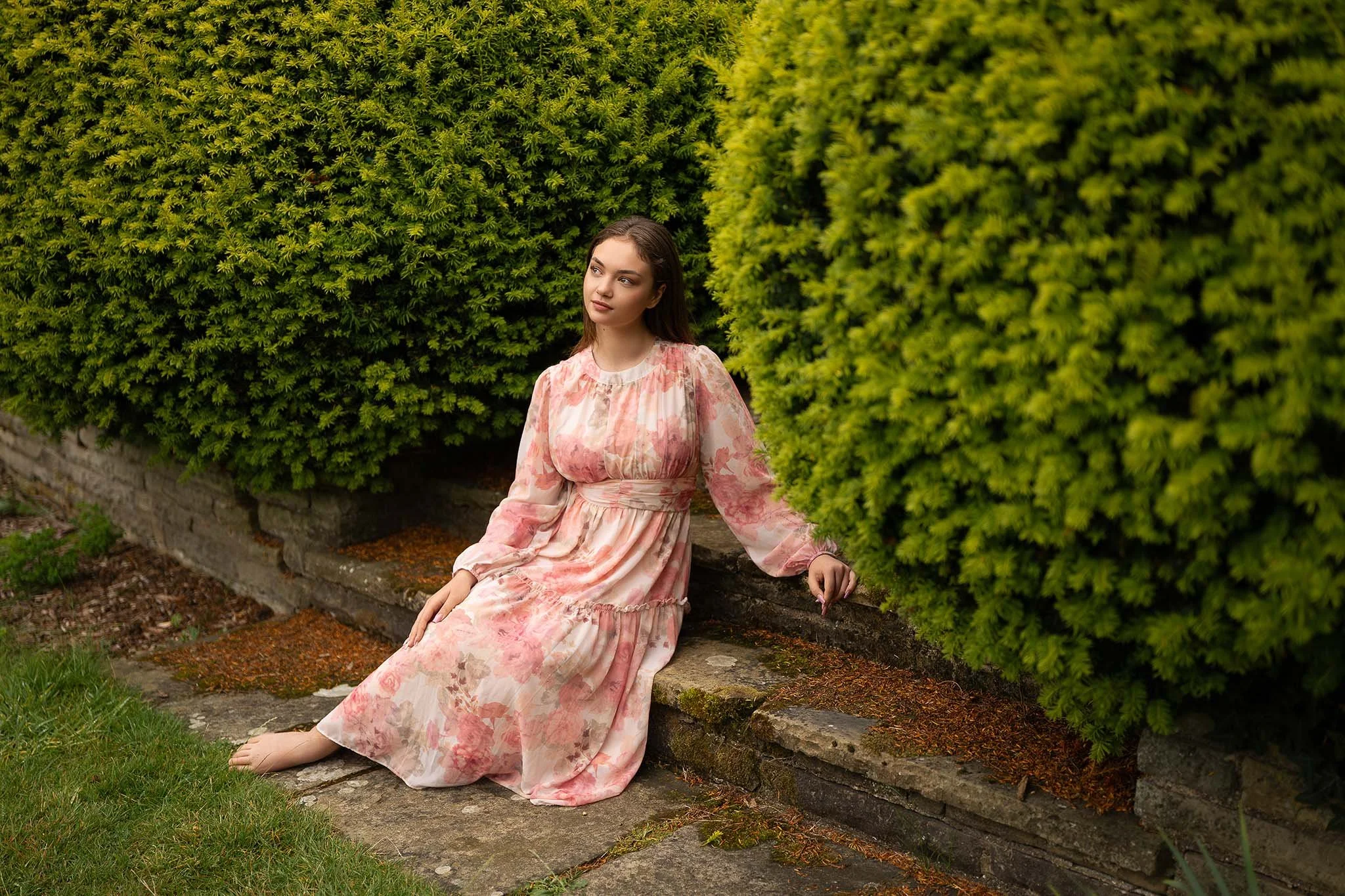 Romantic outdoor portrait with vibrant greenery and soft textures, taken during a summer garden mini session in Edgware.