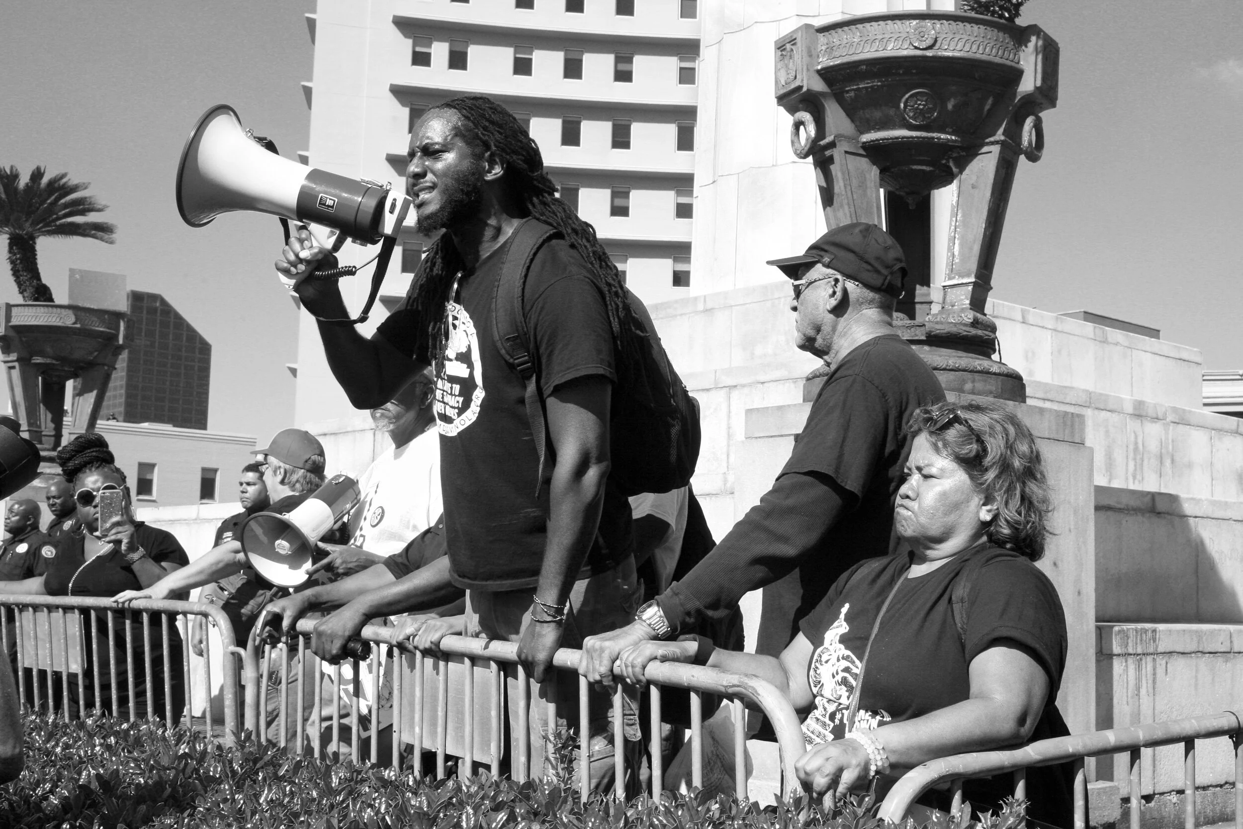 Michael "Quess" Moore, co-founder of Take 'Em Down NOLA, speaking at a protest in front of Lee monument