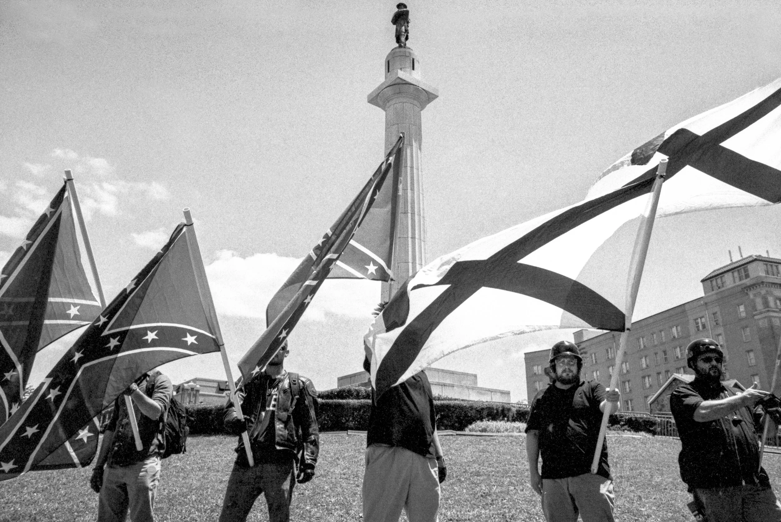 White Nationalists waving Confederate and Southern Nationalist flags at Lee monument