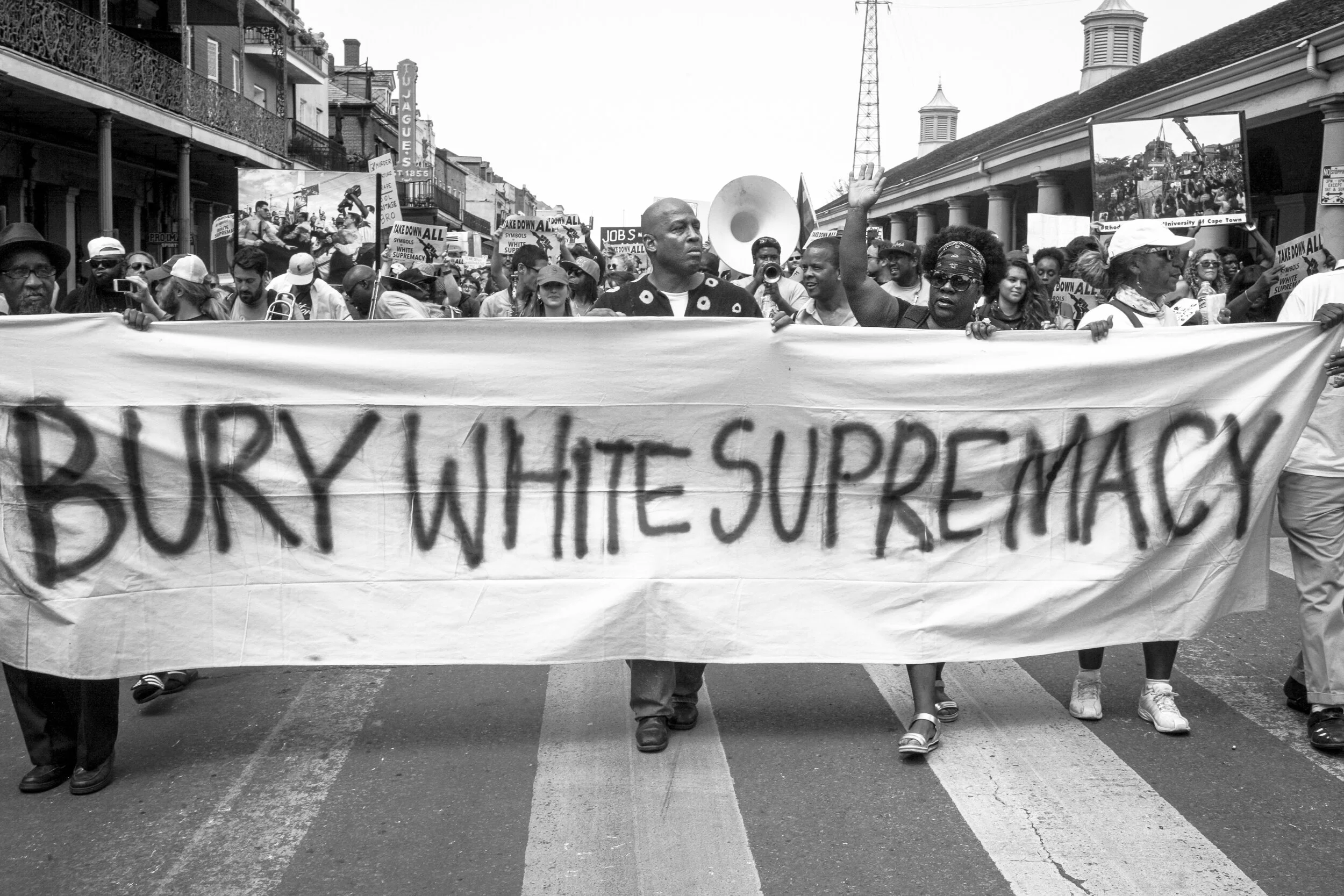Chuck Perkins, New Orleans poet/activist (center) with fellow protestors participating in march to remove monuments to white supremacy