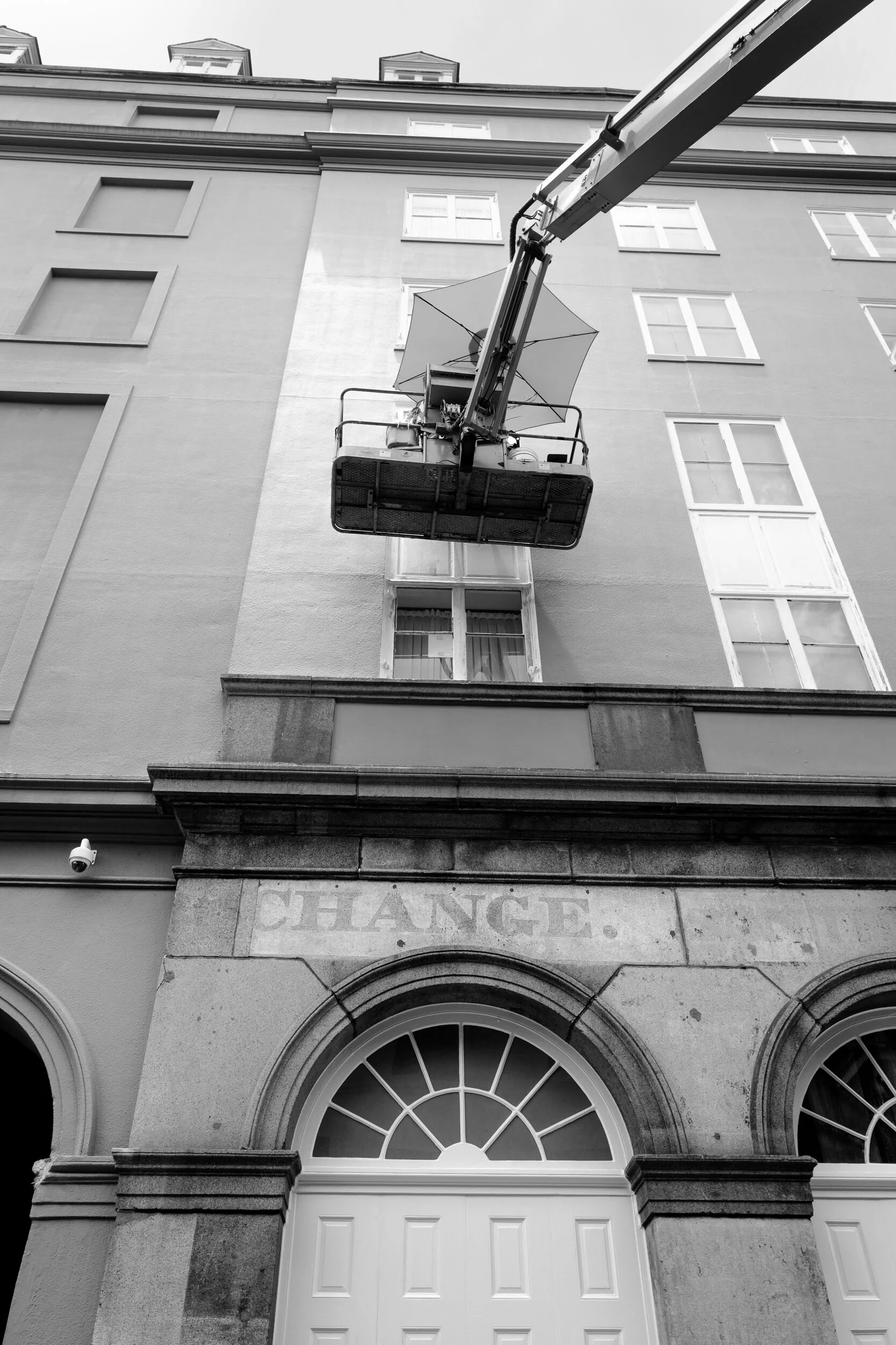The site of the largest slave market in the country of the antebellum era on Royal Street has no historical marker of this history, though the letters "CHANGE" still exist on the original arched street level façade which was preserved when the luxury