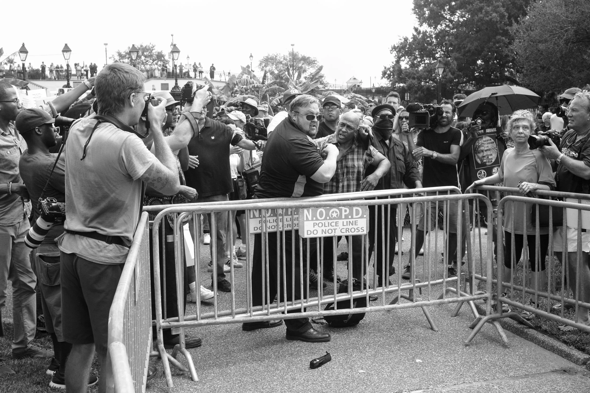 Physical confrontation erupts during protest, Jackson Square, Chuck Perkins poet/activist (center-right)