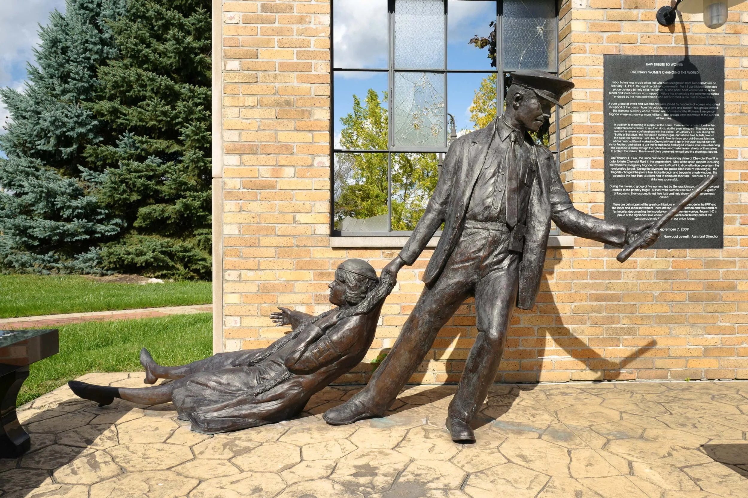 1936-1937 Flint Sit-Down Strike—Sculpture at Sitdowners Memorial Park depicting an officer dragging a member of the Women's Emergency Brigade. During the historic 44-day Flint sit-down strike, members of the United Auto Workers occupied Fisher Body P