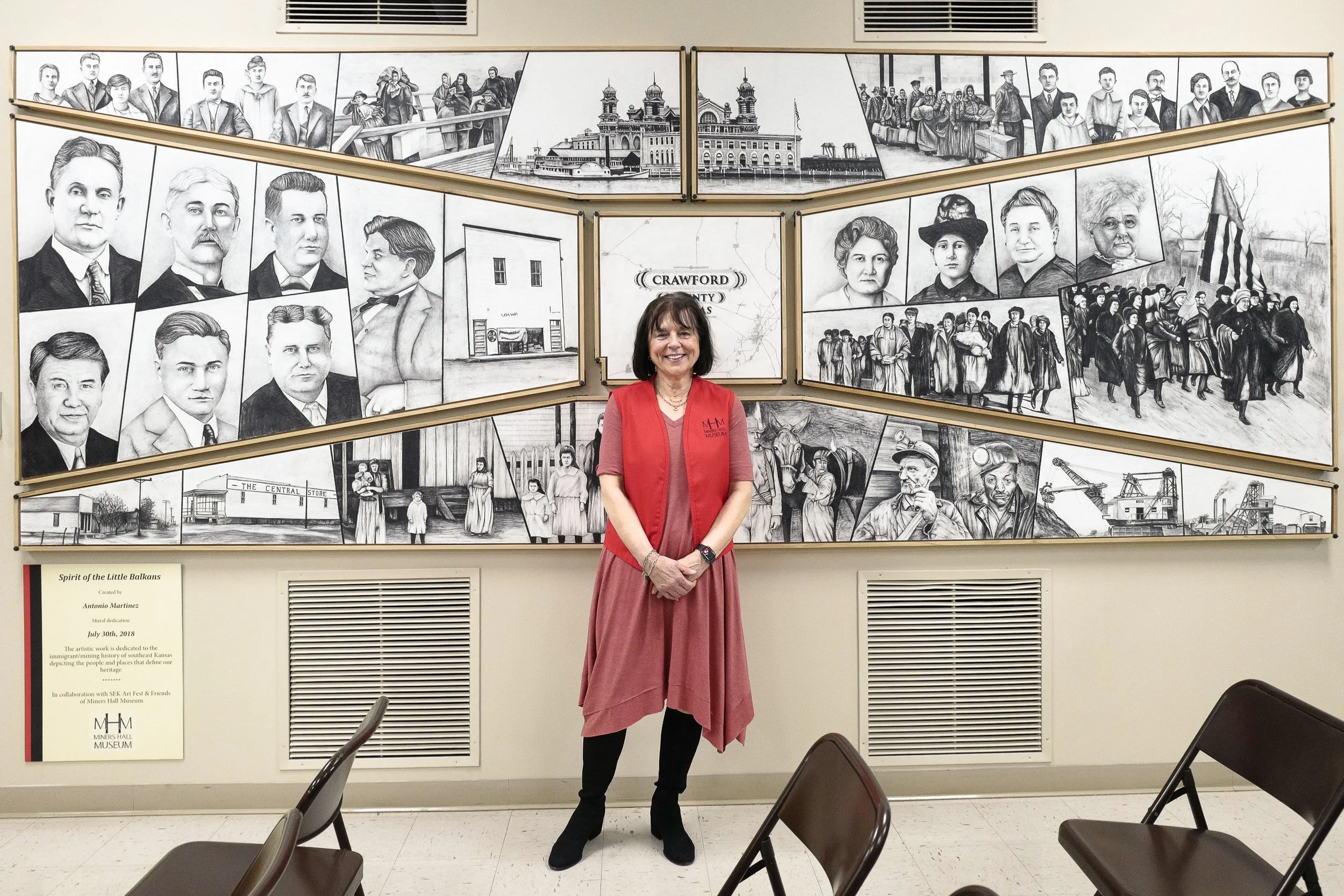 1921 Amazon Army—Linda O’Nelio Knoll before the ‘Spirit of Little Balkans’ mural at the Miners Hall Museum. In Southeast Kansas, 2,000–6,000 women marched to protest unfair labor practices, poor pay and dangerous working conditions, shutting down coa