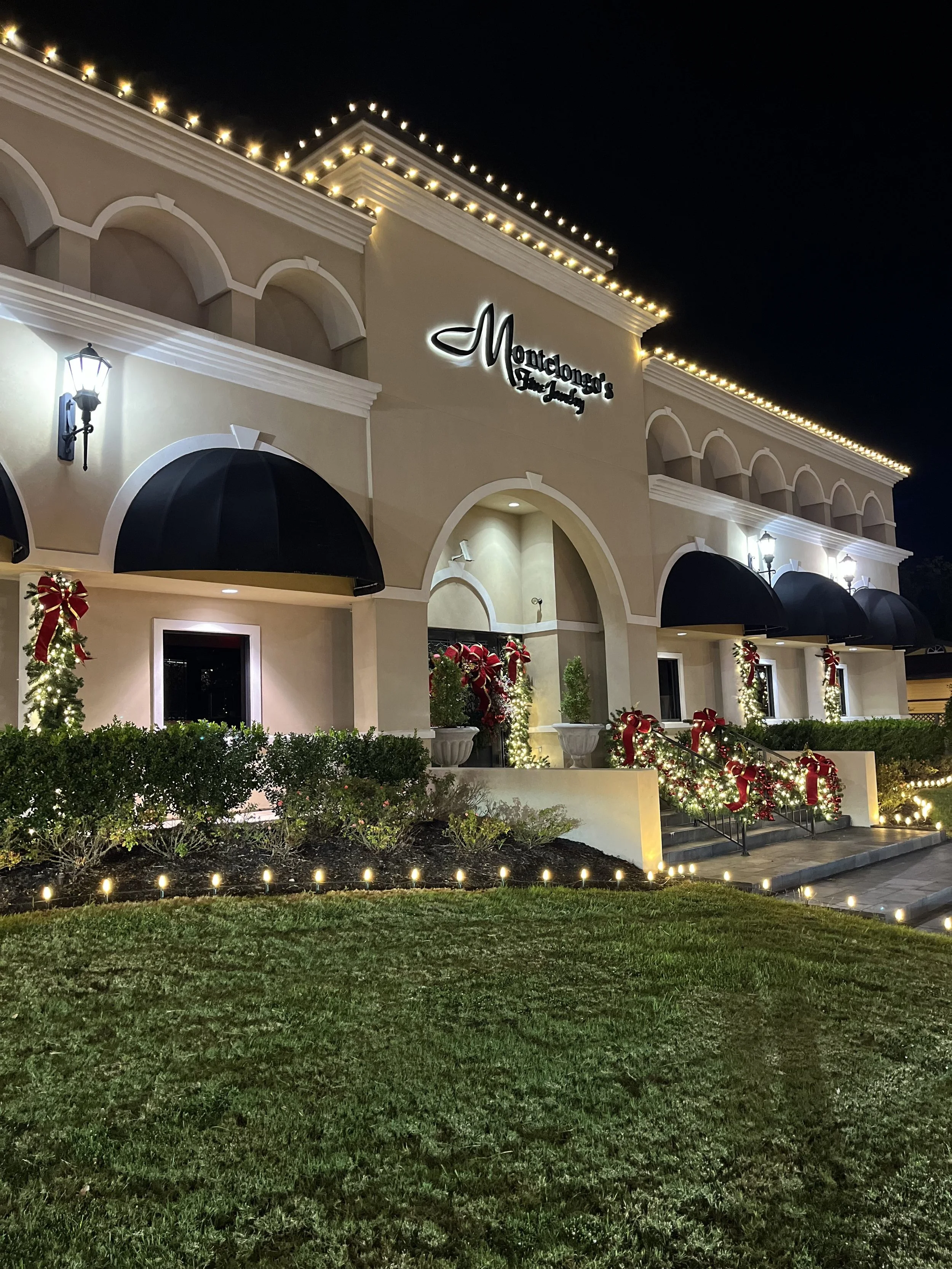 Montelongos Jewelry Store College Station Decorated by Aggieland Christmas Lights and Ernie Bows