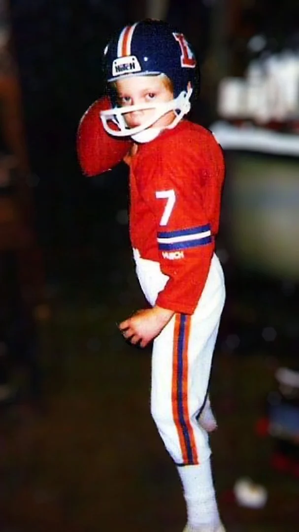 Photograph of Sports Artist Alvin Fall in his Denver Broncos uniform on Christmas day 1986