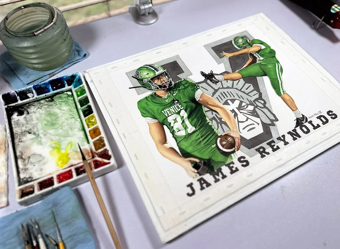 The finished painting on the studio desk alongside the working palette and brushes — giving a sense of the 11" x 14" scale and the tools used to bring the piece to life.