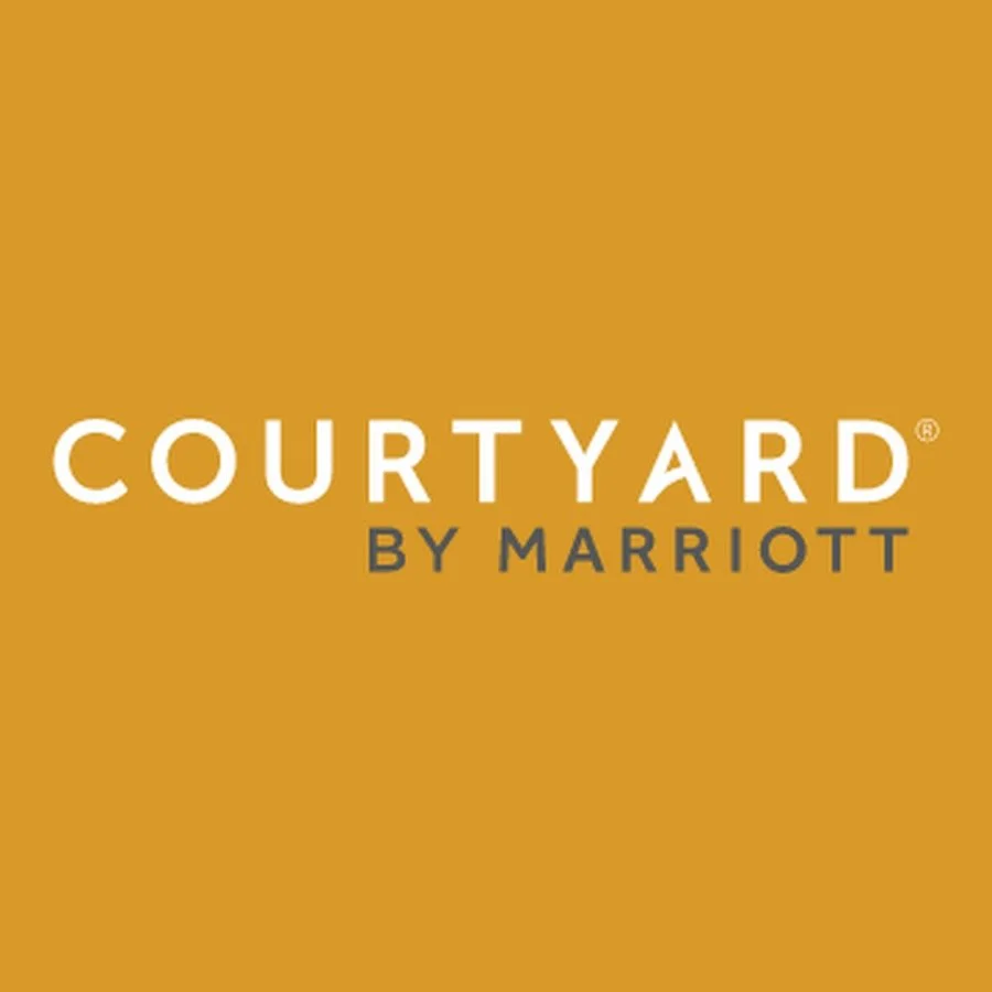 Courtyard by Marriott logo on a gold background.
