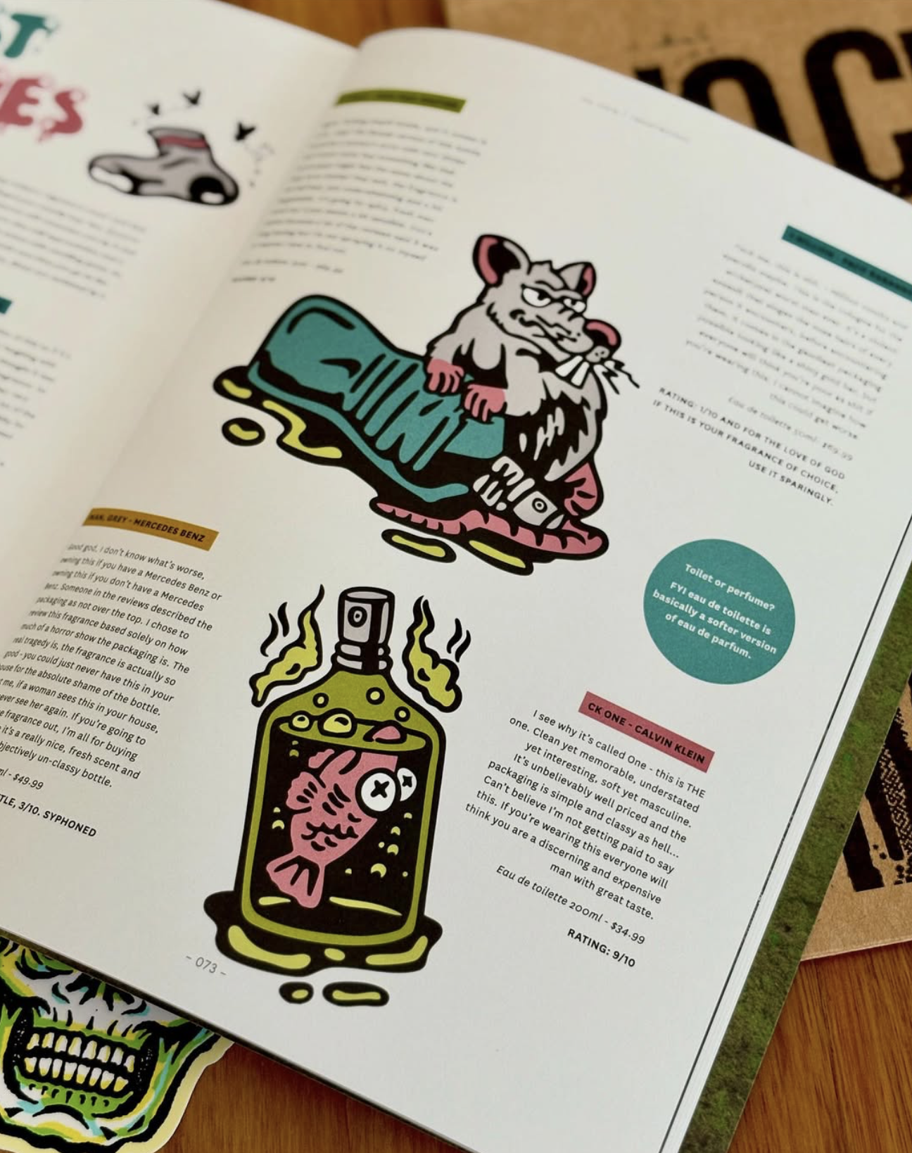 Colorful cartoon illustrations of a lion holding a magazine and a bubbling perfume bottle with a fish inside, on a magazine page.
