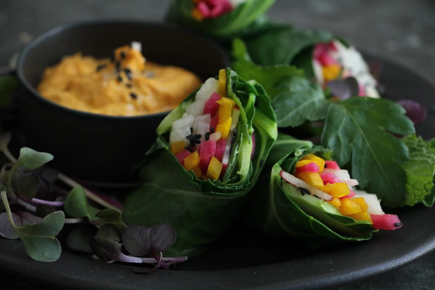“Spring Rolls”
New item on my Bay Area Spring Menu- features colorful radishes, radish sprouts, beets, tofu, fresh herbs, wrapped in collard greens and served with a deep spiced carrot sesame dip. 
📸 @nataliapoltoratzky 
Props, surface