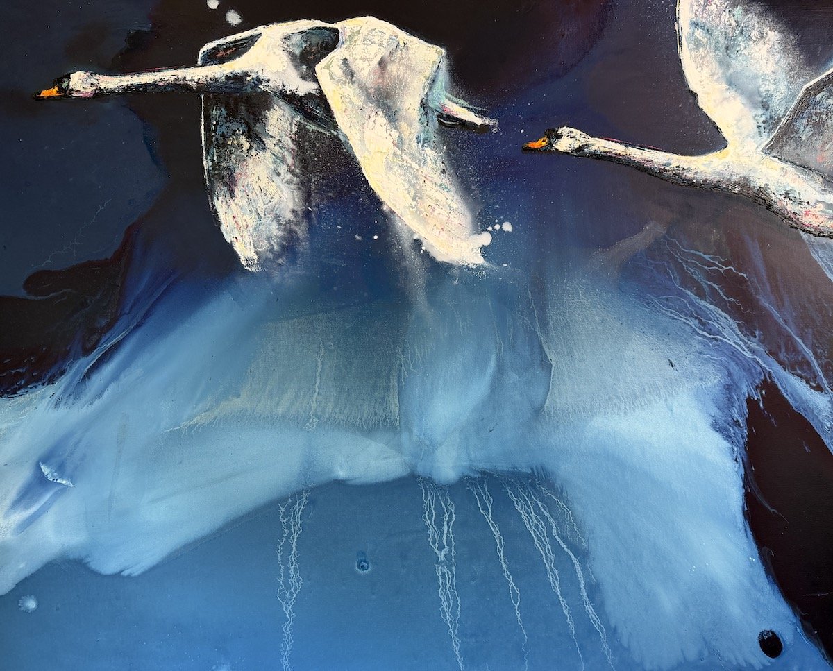 Abstract painting of two swans flying over icy blue water with a dark background.