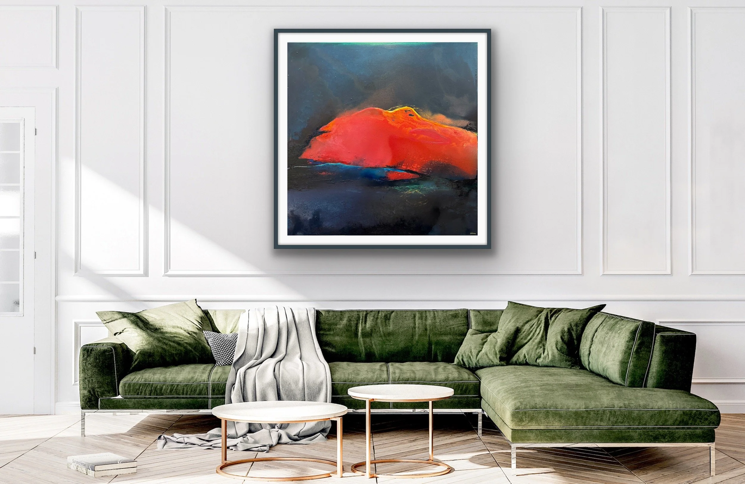 Living room with white paneled walls, a large colorful abstract painting, a green velvet sofa with pillows and a throw blanket, two small round side tables, and wooden flooring.