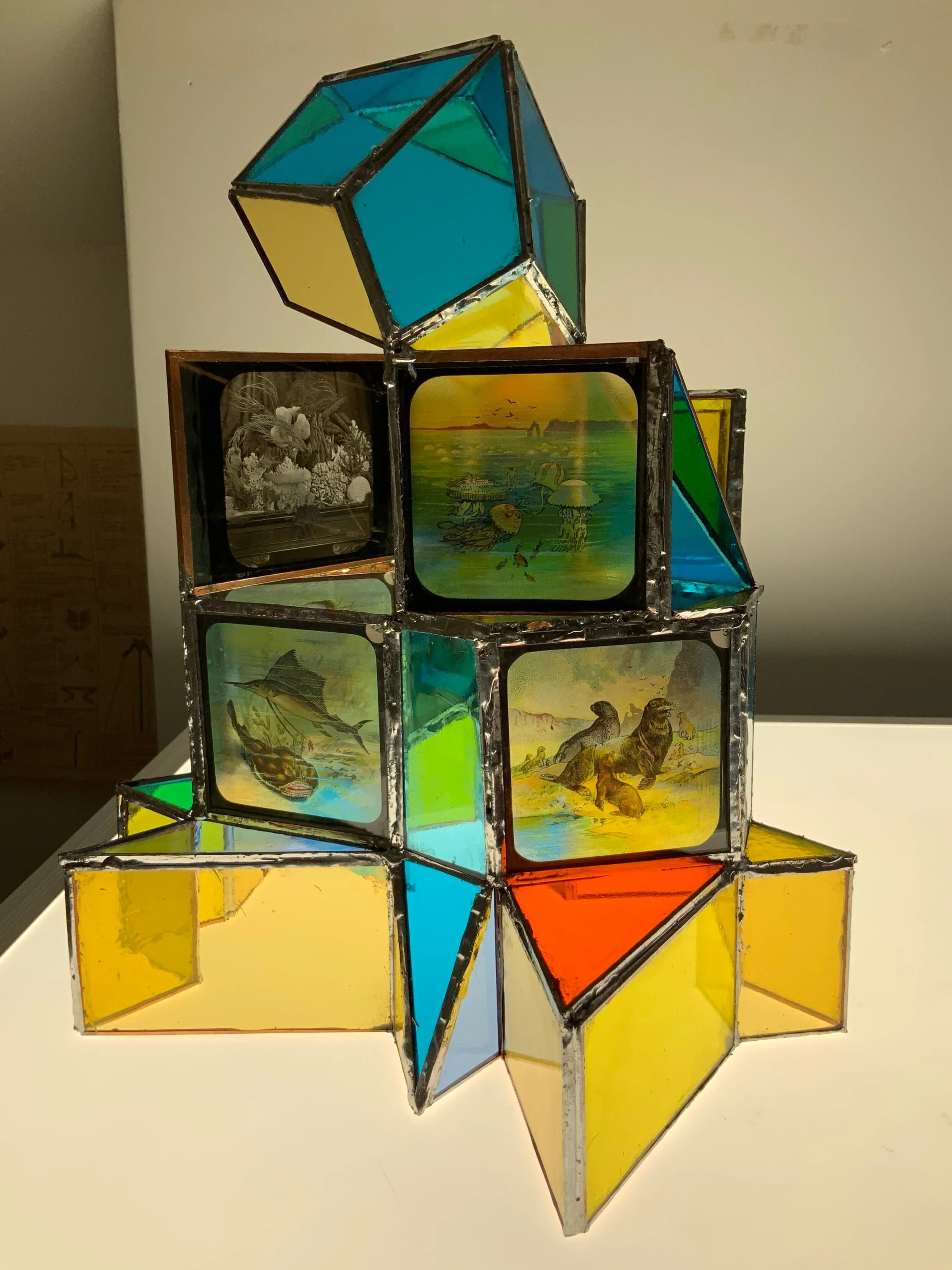 Architecture for an Extinct Planet: Sea Creatures, 2020, Coloured glass, magic lantern slides, copper tape and solder 27 x 30 x 33cm