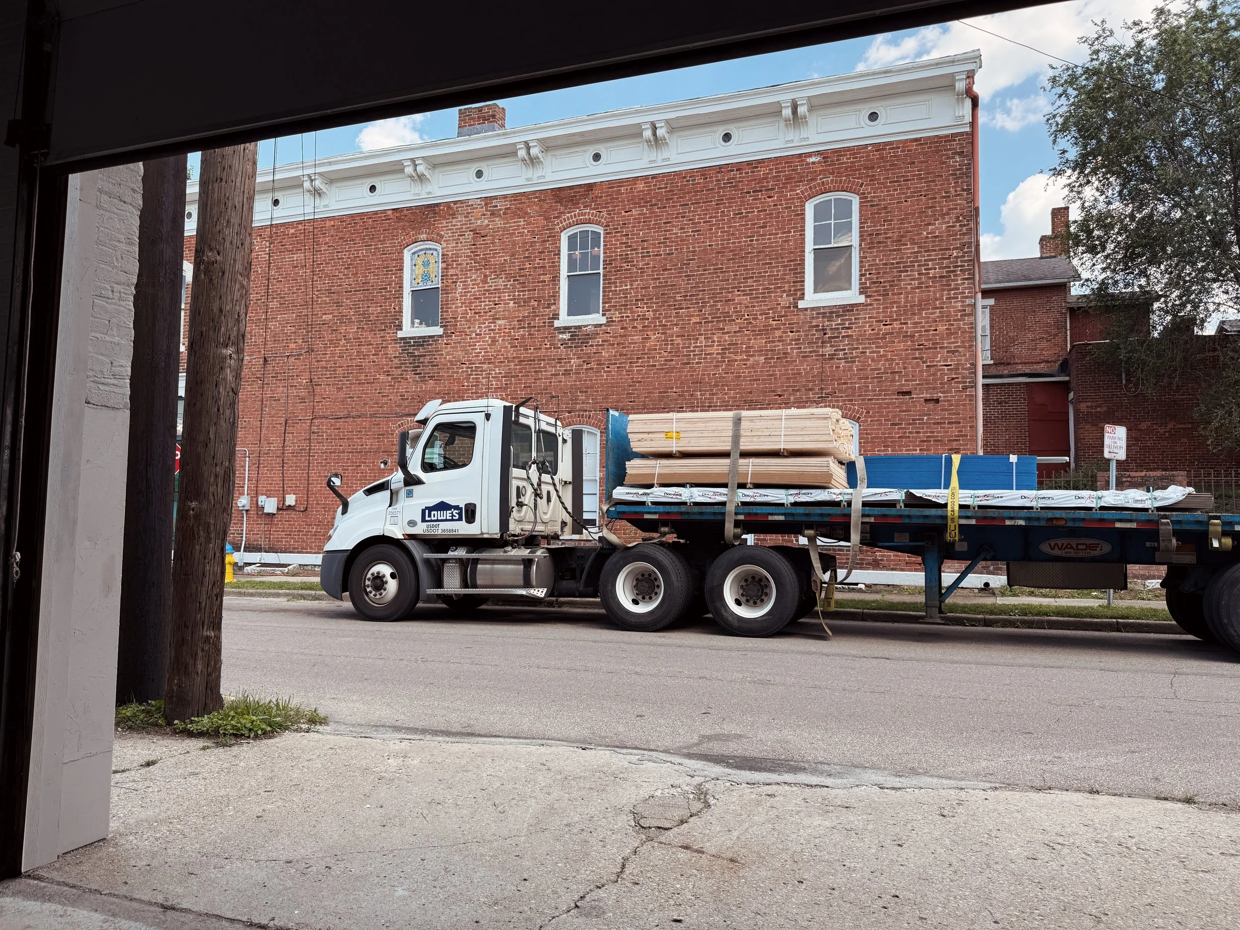 Lowes delivery of multiple pallets of wood.JPG