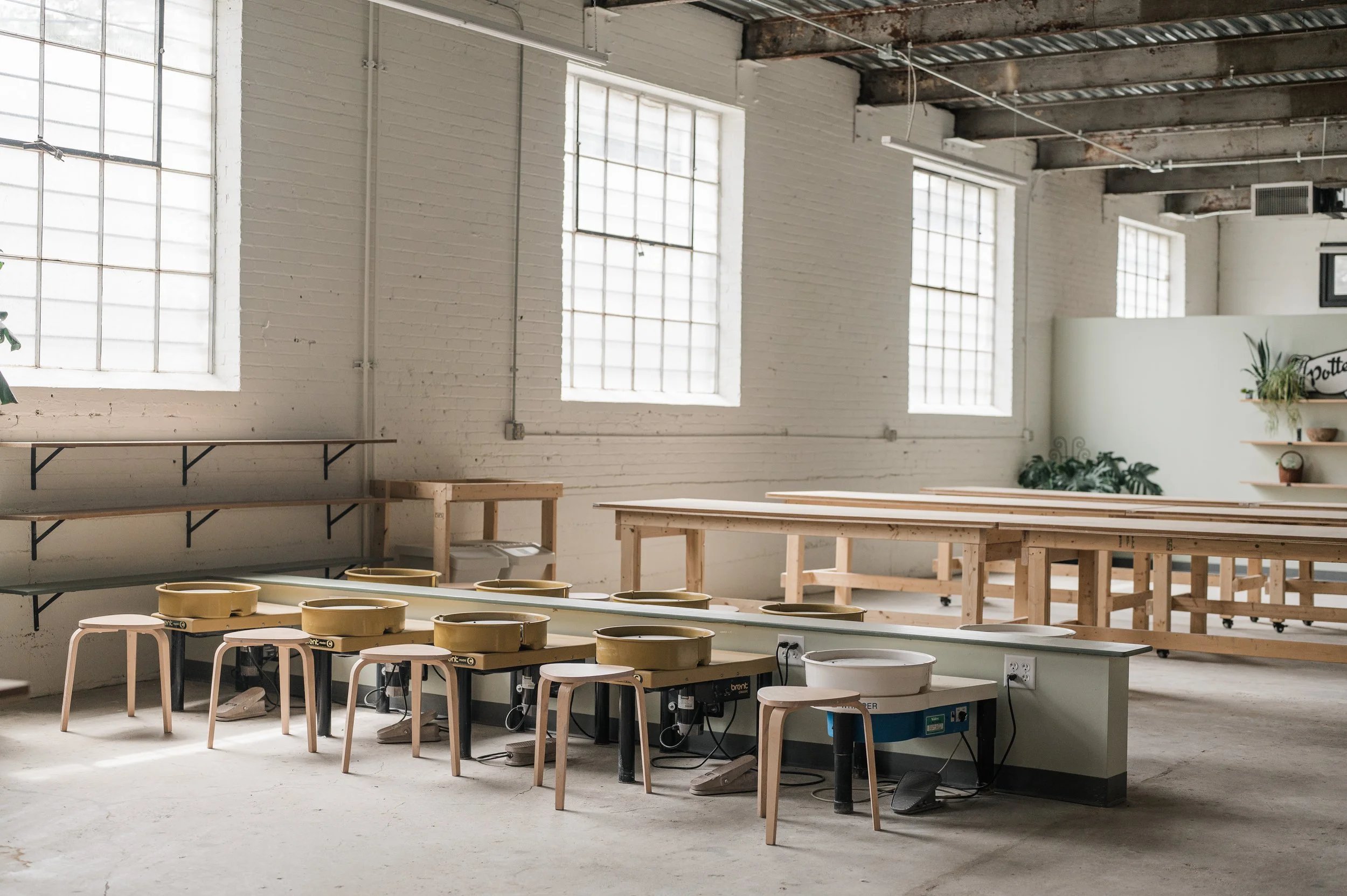 MADE Studio & Shop membership space with 10 pottery wheels and work tables