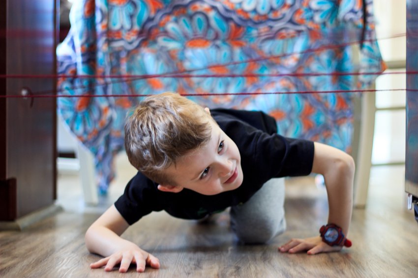 Photo of little boy playing on the floor