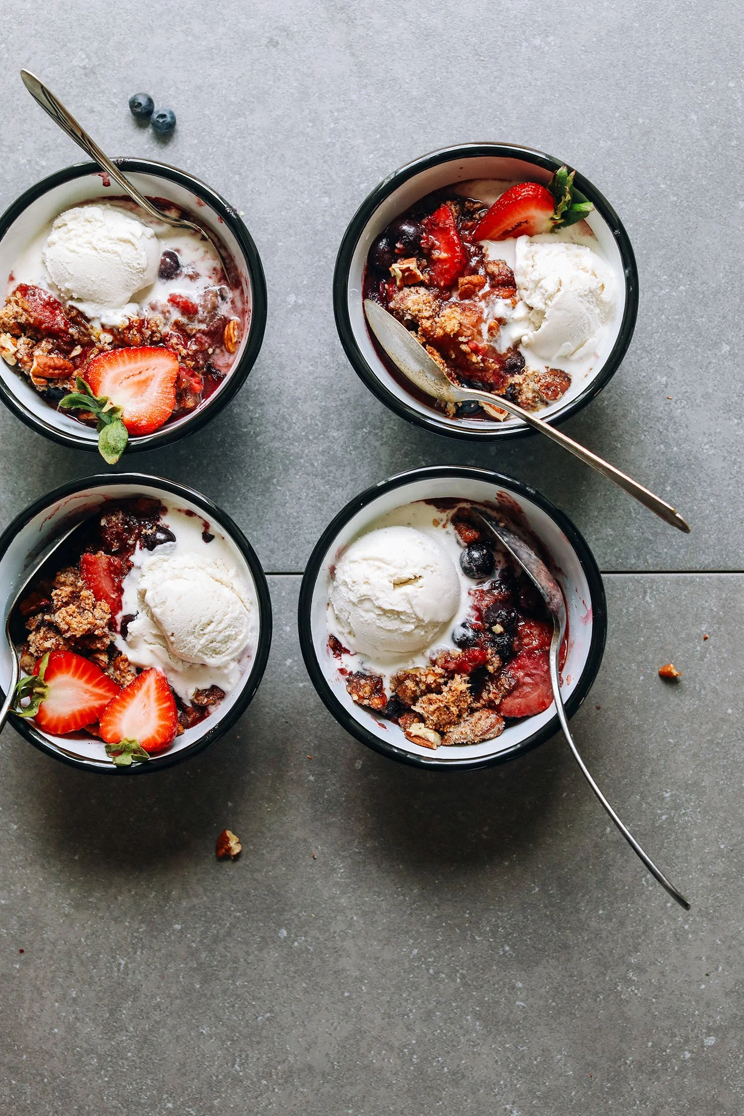 gluten free berry crisp with ice cream in bowls