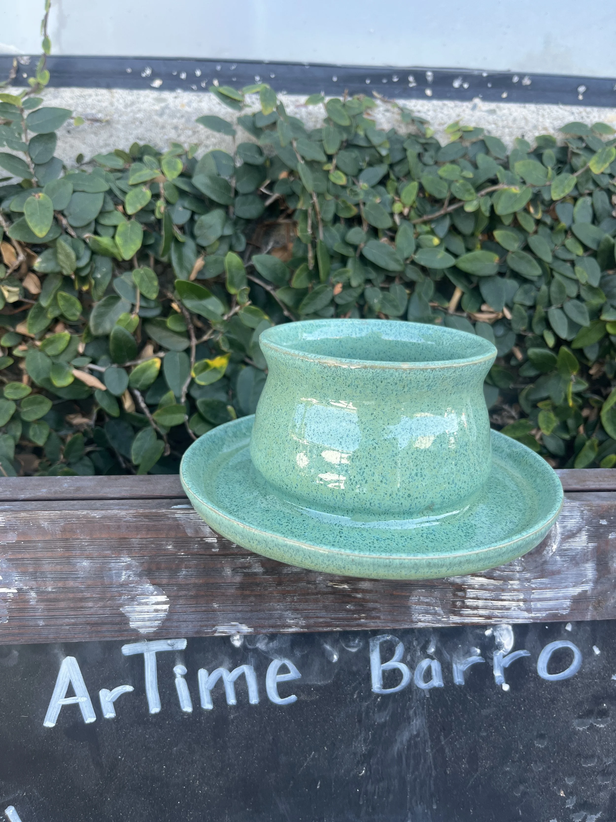 Handmade green ceramic planter with attached drip tray at ARTime BARRO Costa Mesa