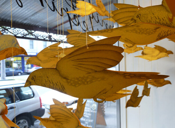 Gracia Haby &amp; Louise Jennison, A Charm of Finches Good as Gold in the window of Milly Sleeping’s Carlton store