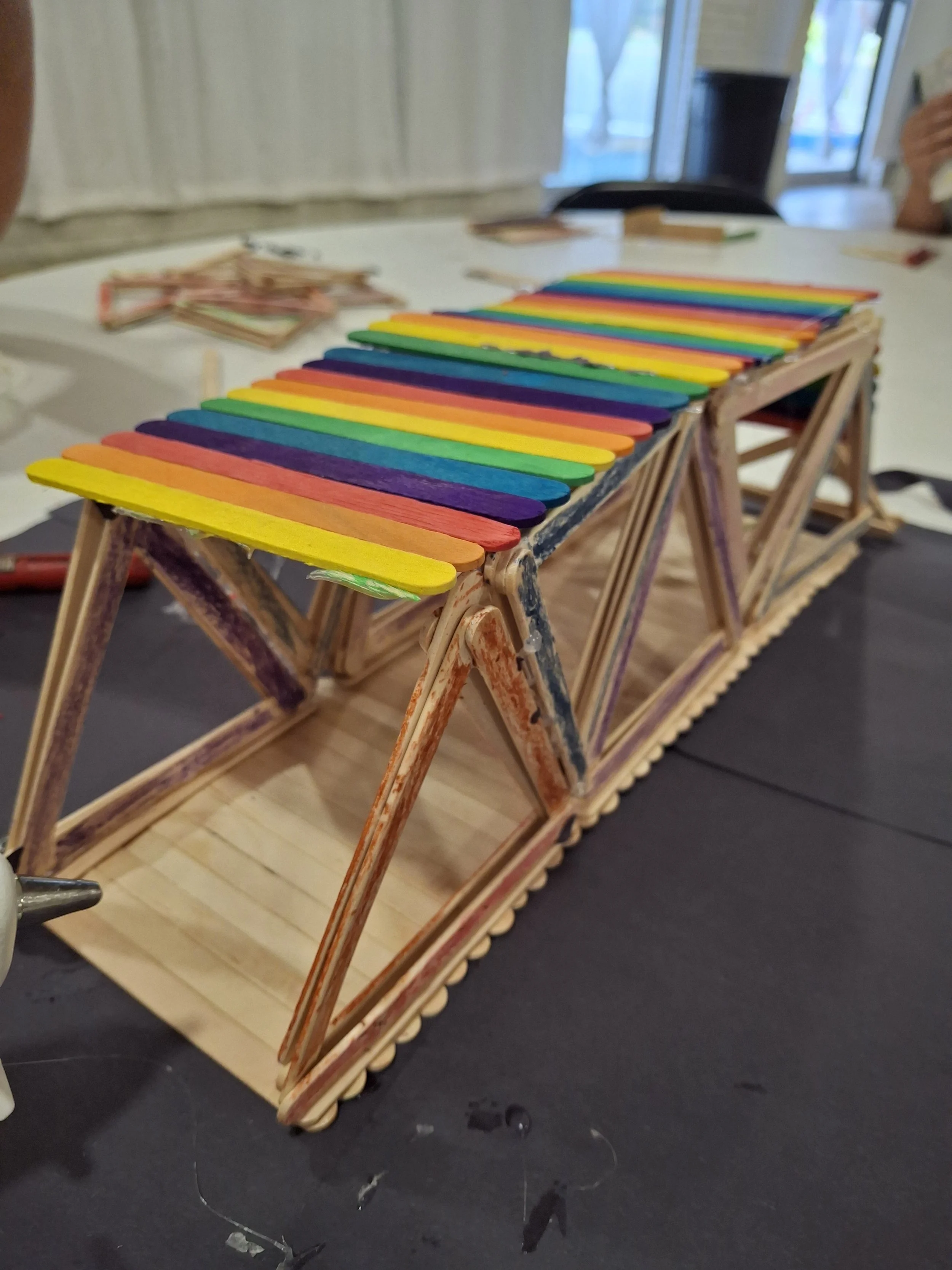 Our little camp engineers built a bridge made of craft sticks