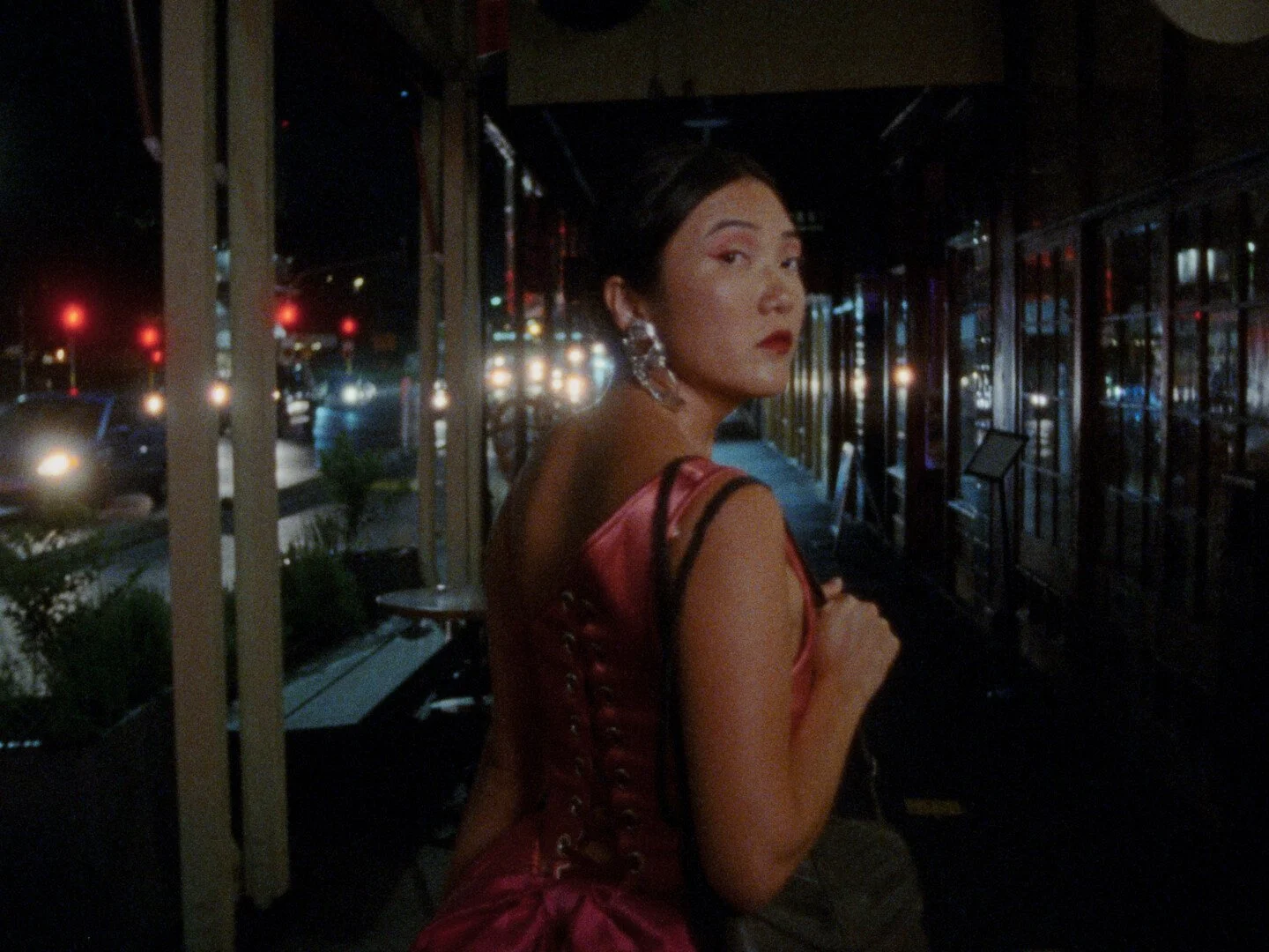 Still image from the film "Some Kind of Blue" showing a woman looking back at the camera