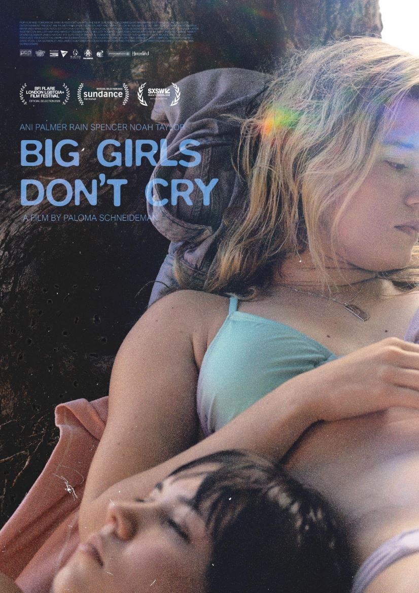 A poster for Big Girls Don't Cry - To the right side of the poster a blonde woman leans against a rock, in the lower left side a woman with black hair rests her head on the blonde woman