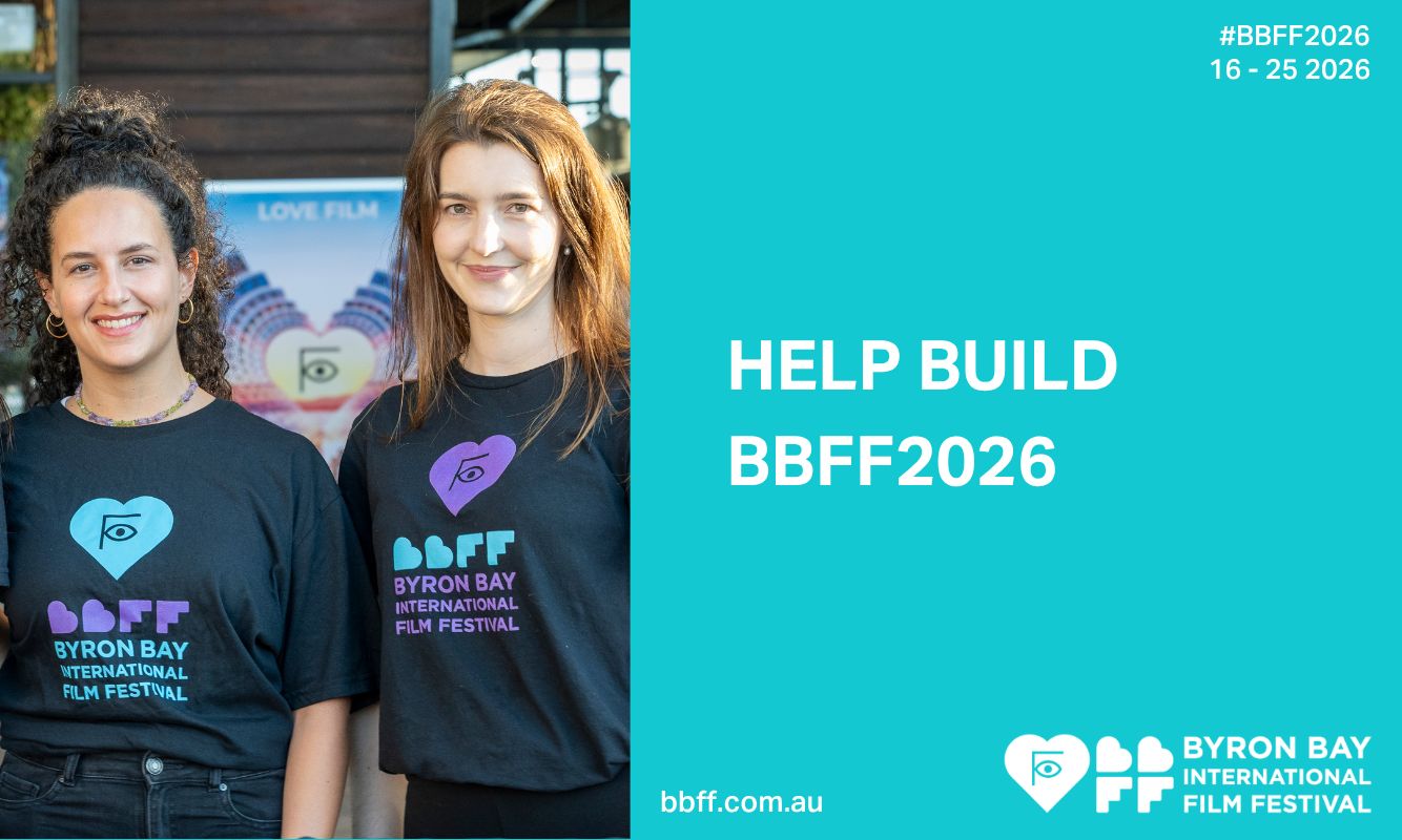 Two young women wearing Byron Bay Film Festival T-Shirts with the call to help Build BBFF2026