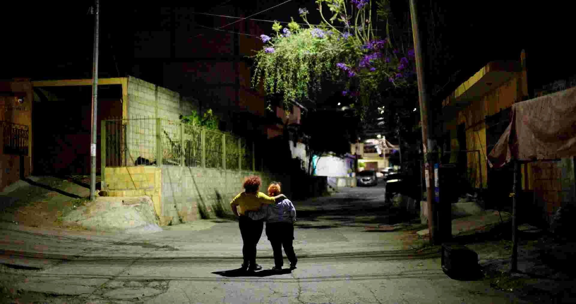 Photo 6 A035C328_Lesli_Lupe_hero_pose_under_street_light.jpg