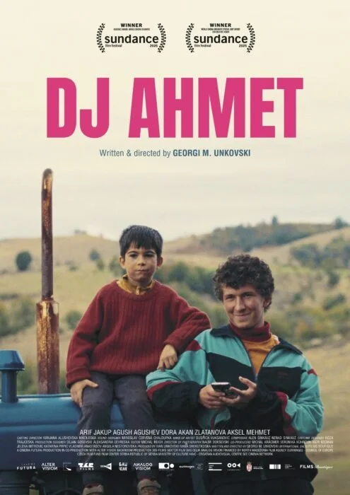 Movie poster titled “DJ Ahmet” showing a boy and a young man sitting on a tractor in a rural landscape, with festival laurels above.