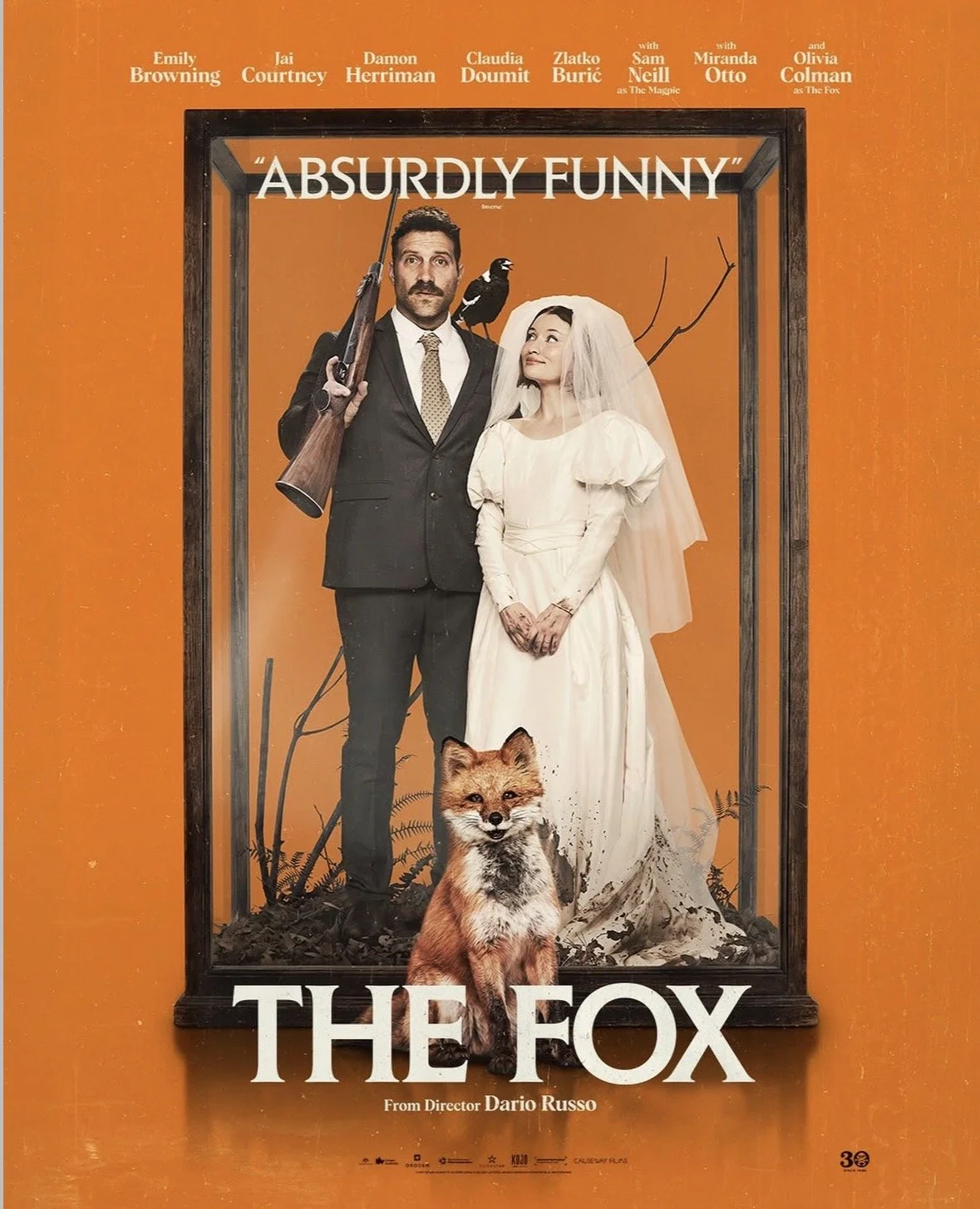 Poster for The Fox - The Heads of a man and woman can be seen against a red background. Each head is split down the middle giving the appearance of having been cracked open, the head of a red fox can be seen emerging from the gap between them.