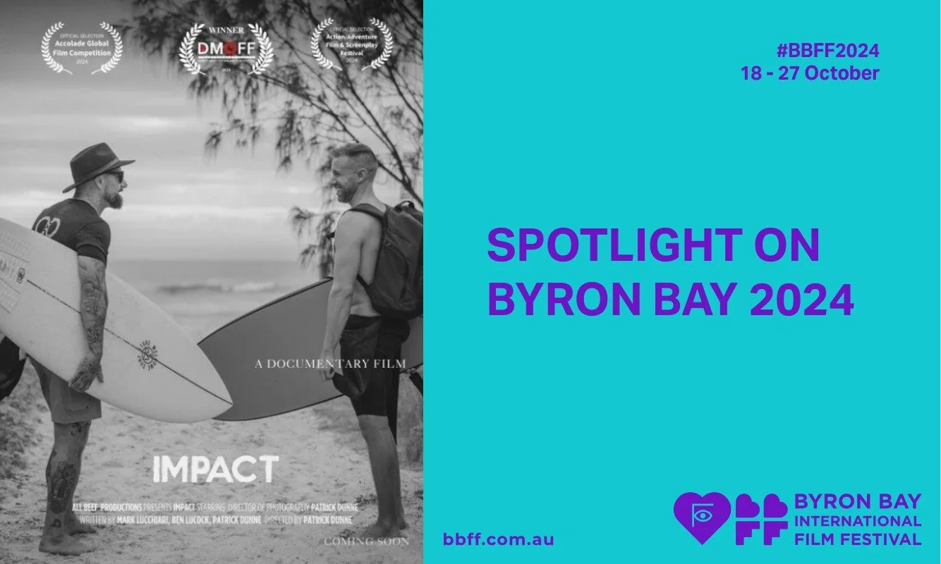 Black and white image of two men with surfboards on a beach. Text reads "Impact: A Documentary Film." Right side has "Spotlight on Byron Bay 2024" in purple on teal.