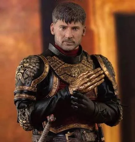 ThreeZero Game of Thrones Jaime Lannister Season 7 1/6 scale figure close-up — golden lion Lannister crest chest armour and gold hand detailing, Nikolaj Coster-Waldau likeness.