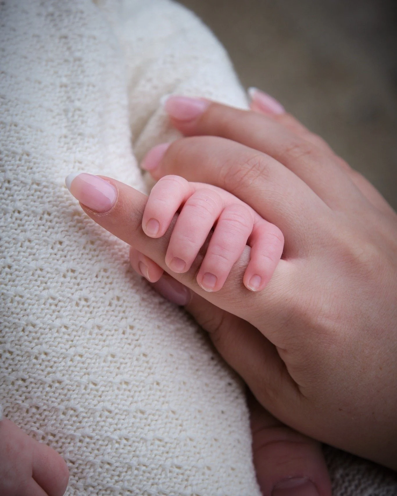 You won&rsquo;t see baskets, props, or elaborate setups in my newborn sessions. That style is incredibly skilled &mdash; it&rsquo;s just not what I do. I want your baby in your arms. I want to document how small they are against your chest, the way y